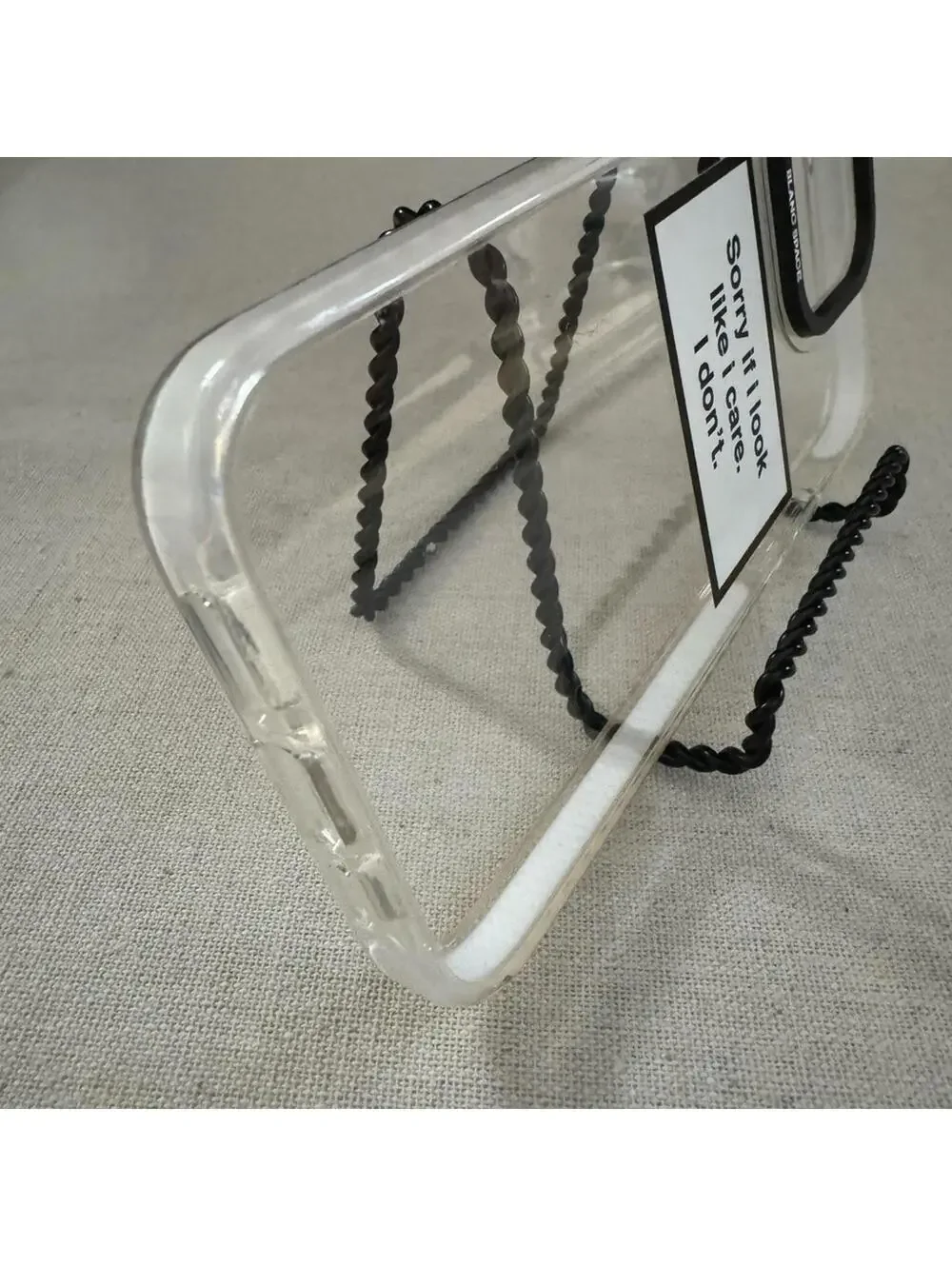 Blanc Space iPhone 14 Pro Max clear phone case with text